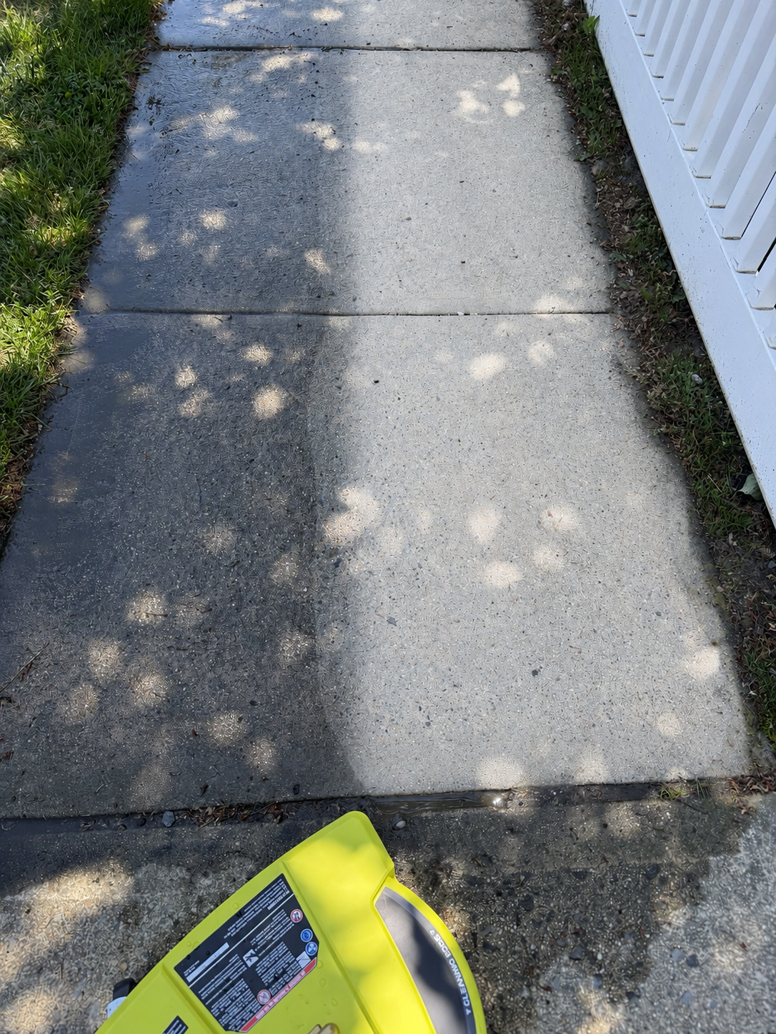Sidewalk before and after cleaning by Top Shine Exterior Services